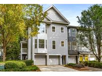 Inviting townhouse with a two-car garage and beautifully maintained landscaping at 951 Glenwood Ave # 801, Atlanta, GA 30316