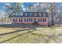 Charming brick home with classic black shutters and lush green lawn, perfect for Gathering living at 4332 N Hickory Ln, Douglasville, GA 30134