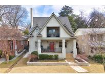 Charming two-story home featuring a red front door, covered porch, and a second story balcony at 101 Terrace Dr, Atlanta, GA 30305
