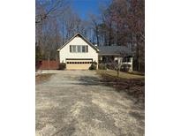Traditional home with a two-car garage and driveway at 1531 Glendale Dr, Lawrenceville, GA 30043