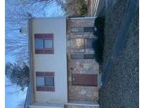 Two-story house with vinyl siding, stone accents, and mulled windows at 3626 Hopkins Ct, Powder Springs, GA 30127