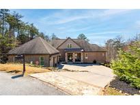 Beautiful brick home with attached garage, stone accents, and well-manicured front yard at 15 York Trce, Cartersville, GA 30121