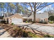 Charming home with a well-manicured lawn, long drive way, and inviting curb appeal at 108 Great Oaks Lane, Roswell, GA 30075