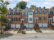Charming brick townhomes with individual garages and well-maintained landscaping at 5341 Concordia Se Pl # 8, Mableton, GA 30126