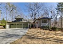 Charming home with a spacious driveway and a three-car garage, perfect for a growing Gathering at 218 Sutallee Ridge Ne Ct, White, GA 30184