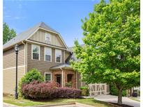 Inviting home exterior featuring stone accents, manicured landscaping, and a welcoming covered entry at 1907 Haven Park Se Cir, Smyrna, GA 30080
