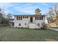 Charming one-story home with a classic design and well-maintained front yard at 2302 Abner Nw Pl, Atlanta, GA 30318