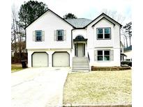 Charming two-story home with a two-car garage, inviting entrance, and well-maintained front lawn at 4258 Anderson Ridge Way, Austell, GA 30106