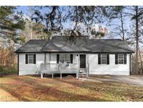 Charming home with a covered front porch and freshly painted exterior at 247 Mandy Ct, Mcdonough, GA 30252