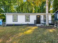 Charming single-story home features a freshly painted exterior, modern windows, and a well-manicured lawn at 338 Lincoln Sw St, Atlanta, GA 30315