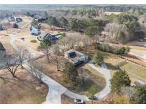 Expansive property featuring a long driveway and mature trees in a serene, established neighborhood at 4951 Center Hill Church Rd, Loganville, GA 30052