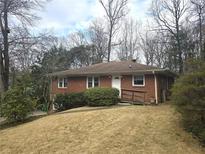 Charming brick home with a well-maintained front yard and accessible ramp at 1288 N Emory N Pl, Atlanta, GA 30306