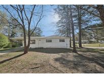 Charming single-story home with a carport and a well-maintained front yard at 10152 Griffin Sw Ln, Covington, GA 30014