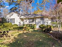 Charming single-story home with a well-manicured lawn and mature landscaping at 1116 Citadel Dr, Atlanta, GA 30324
