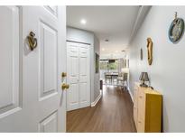 Inviting hallway features wood floors and stylish decor leading into the living area at 1501 Clairmont Rd # 535, Decatur, GA 30033