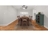 Dining room with wood floors, table, decor and a ceiling fan at 6851 Roswell Rd # F32, Sandy Springs, GA 30328