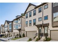 Modern townhome exteriors featuring neutral siding, dark trim, and attached garages, perfect for sophisticated urban living at 1322 Stanley Park Dr, Decatur, GA 30033