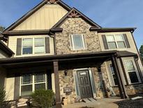 Charming two-story home with stone accents and a welcoming front porch at 150 Bellemeade Ct, Fayetteville, GA 30215