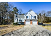 Charming two-story home with a two-car garage and well-maintained front yard at 2971 Ruby Ct, Powder Springs, GA 30127