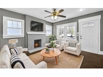 Inviting living room with cozy fireplace, ample seating, and neutral decor at 2006 Conrad Se Ave, Atlanta, GA 30315
