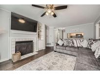 Inviting living room with a cozy fireplace and modern furnishings, perfect for relaxation and entertaining at 3655 Habersham Ne Rd # 227, Atlanta, GA 30305