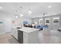 Bright open concept living room and kitchen with modern finishes and ample natural light at 3037 Ferrington Way, Smyrna, GA 30080