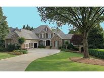 Charming, stone-accented home with a well-manicured lawn and inviting curb appeal at 2813 Long Grove Ct, Marietta, GA 30062