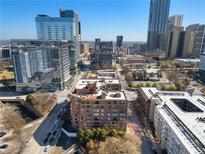 A high-angle shot looking towards the city with an eye-level view of surrounding buildings at 115 W Peachtree Nw Pl # 602, Atlanta, GA 30313