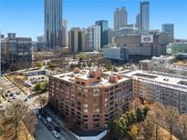 Brick apartment building in a bustling urban environment, near parking and lots of downtown businesses and destinations at 115 W Peachtree Nw Pl # 602, Atlanta, GA 30313