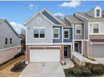 Charming two-story home with a two car garage, landscaped yard, and inviting entryway at 126 Maple Creek Way, Woodstock, GA 30188