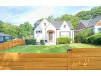Charming cottage-style home featuring a well-manicured lawn and decorative front door at 98 Chappell Nw Rd, Atlanta, GA 30314