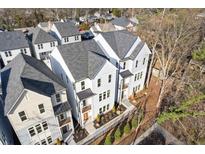 An aerial view of new modern townhomes with neutral colors, black framed windows, and professionally landscaped yards at 488 Hammons Way, Atlanta, GA 30315