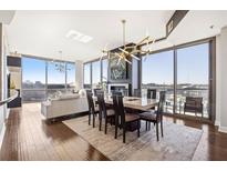 Bright and airy living room featuring floor-to-ceiling windows and modern lighting fixtures at 270 17Th Nw St # 1213, Atlanta, GA 30363