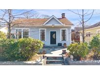 Charming home with a well-maintained front yard, stone walkway, and welcoming entryway at 899 Ponce De Leon Ne Pl, Atlanta, GA 30306