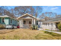 Charming craftsman home with a welcoming front porch and mature landscaping at 1446 Metropolitan Se Ave, Atlanta, GA 30316