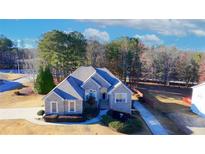 Beautiful brick home with a well-maintained lawn and mature trees in a desirable neighborhood at 101 Fair Oaks Cir, Stockbridge, GA 30281
