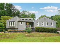 Charming single-Gathering home featuring a well-manicured lawn and a classic, inviting facade at 3087 Sanibel Sw Dr, Stone Mountain, GA 30087