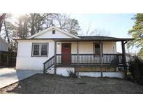 Charming bungalow with a welcoming front porch and a well-maintained lawn at 4681 City View Dr, Forest Park, GA 30297