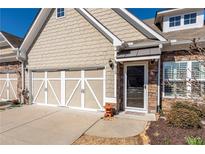 Charming home with a two-car garage, stone accents, and a welcoming front door at 312 Overview Dr, Canton, GA 30114