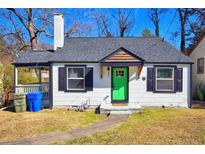 Charming home with a new gray roof, a green front door, and black trim at 232 Mathewson Sw Pl, Atlanta, GA 30314