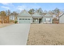 Charming single-story home with a well-manicured lawn and attached two-car garage at 2316 Ridge View Dr, Loganville, GA 30052