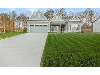 Charming single-Gathering home with a well-manicured lawn and attached two-car garage at 2316 Ridge View Dr, Loganville, GA 30052