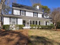Charming two-story home with a welcoming front porch and well-maintained landscaping at 1938 Kelvin Dr, Lawrenceville, GA 30043