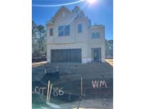 Two-story home with an attached two-car garage; home is under construction at 4315 Easter Lily Ave, Buford, GA 30519