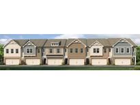 Charming row of townhomes featuring varied exterior finishes and attached two-car garages at 344 Sinclair Ct # 74, Mcdonough, GA 30253