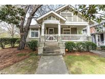 Charming home featuring a welcoming front porch, well-manicured landscaping, and inviting curb appeal at 592 Moreland Ne Ave, Atlanta, GA 30307