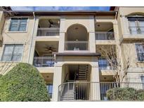 Multi-level condo building featuring balconies with decorative railings and neutral-toned facade at 3777 Peachtree Ne Rd # 722, Brookhaven, GA 30319