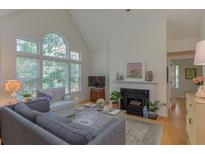 Cozy living room features a fireplace, large windows and neutral decor at 3636 Habersham Rd # 2307, Atlanta, GA 30305