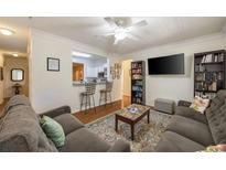 Cozy living room with open floor plan, modern lighting, and comfortable furnishings at 4007 Westchester Ne Rdg, Atlanta, GA 30329