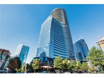 Stunning view of the glass building on a sunny day against the clear blue sky at 3344 Peachtree Ne Rd # 3305, Atlanta, GA 30326